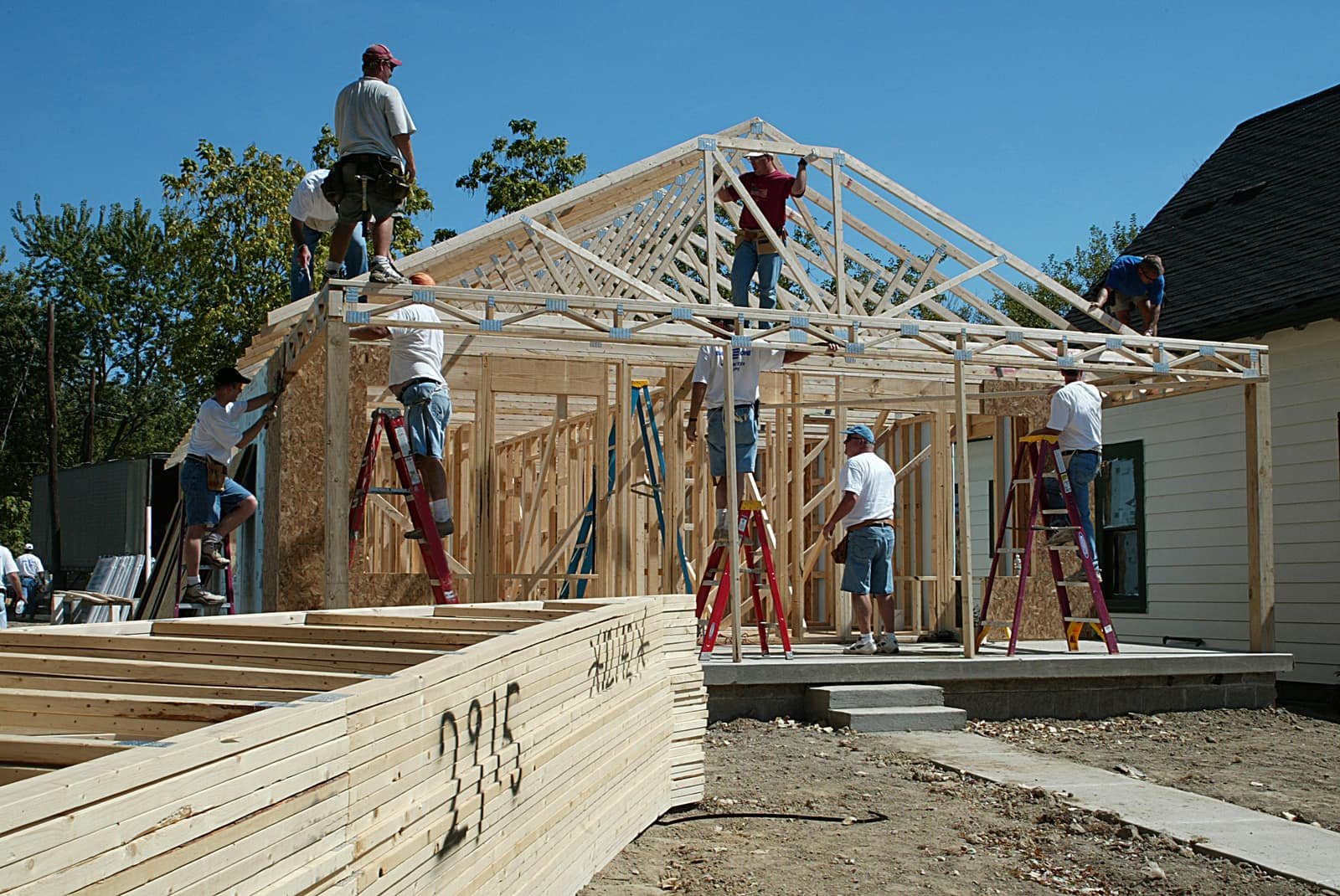 Crew framing a new room addition on a home